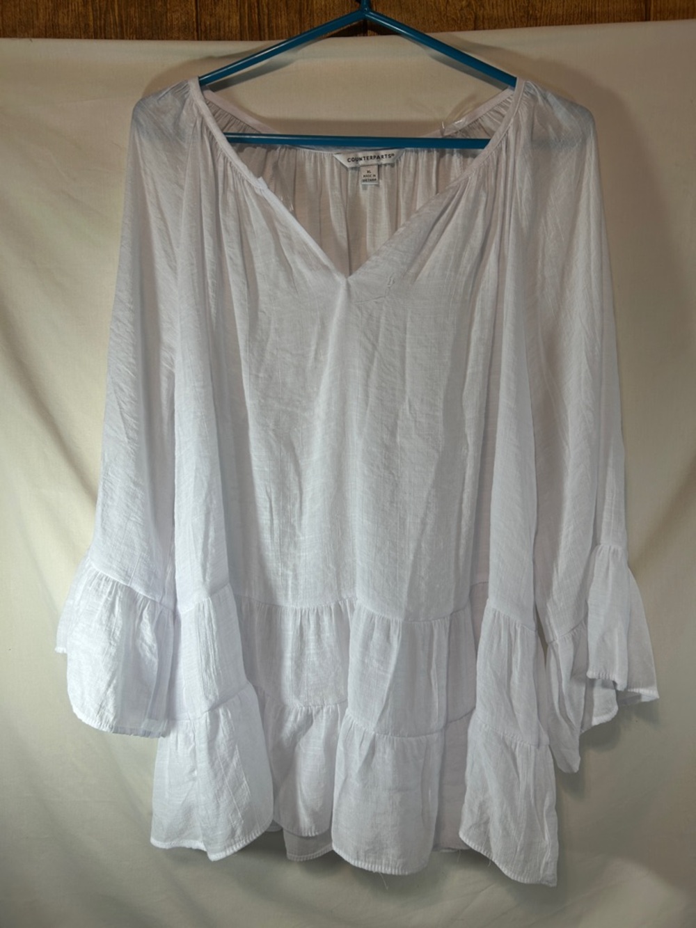 Counterparts Woman’s White Ruffle Tiered V-Neck Tunic